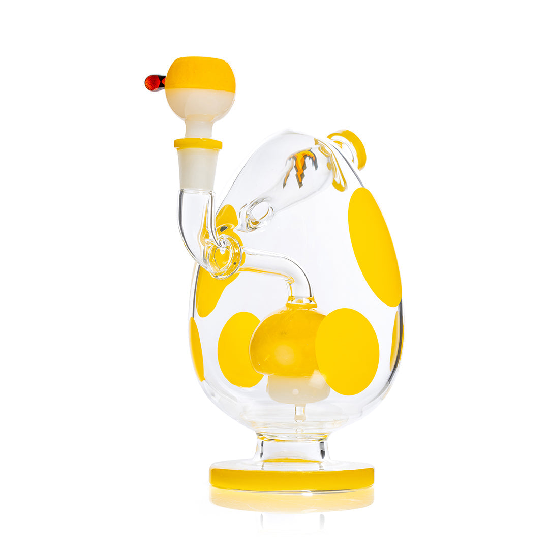 Yellow spotted egg-shaped HEMPER XL bong, 9-inch water pipe with intricate design, displayed on a white background.
