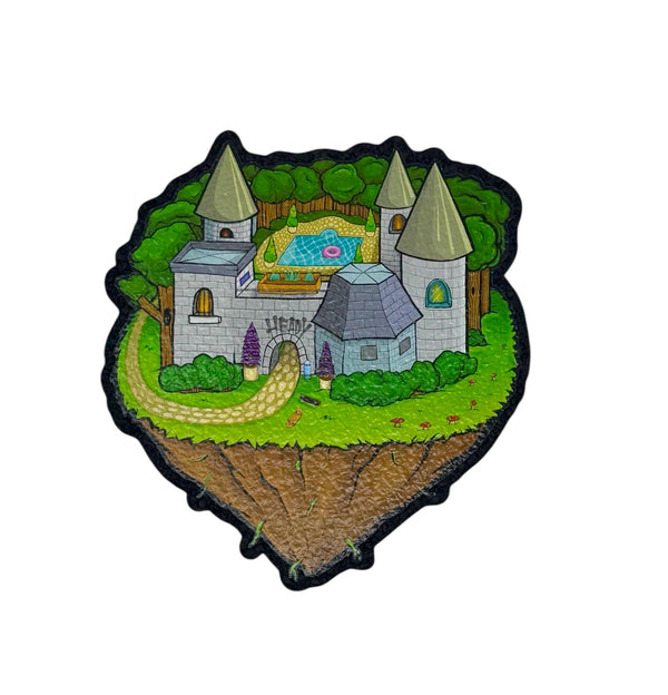 Mood Mats Heady Castle coaster with detailed castle design on a round cork surface for protecting tables.