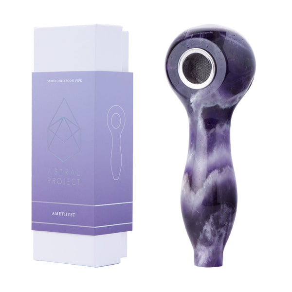 Astral Project gemstone spoon pipe made of purple amethyst with polished finish and intricate natural stone details.