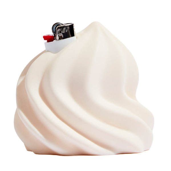 Cream-colored Edie Parker Soft Serve lighter holder with a smooth, rounded design perfect for stylishly holding a lighter.