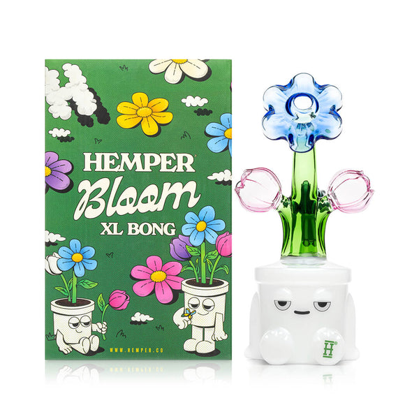 HEMPER Bloom XL Bong with clear glass body and artistic floral design, shown with box on white background.