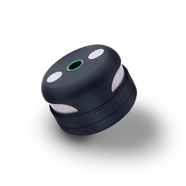 UFO induction heater from The Stash Shack showing a sleek, white, UFO-shaped device on a workbench for cannabis extraction.