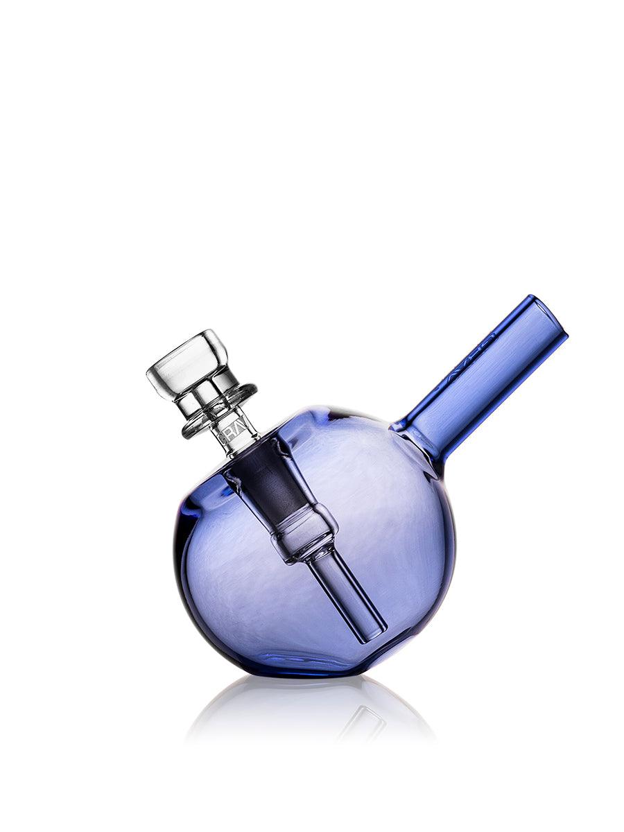 GRAV spherical pocket bubbler in light cobalt blue with colorful accents, compact glass smoking accessory with a rounded design.