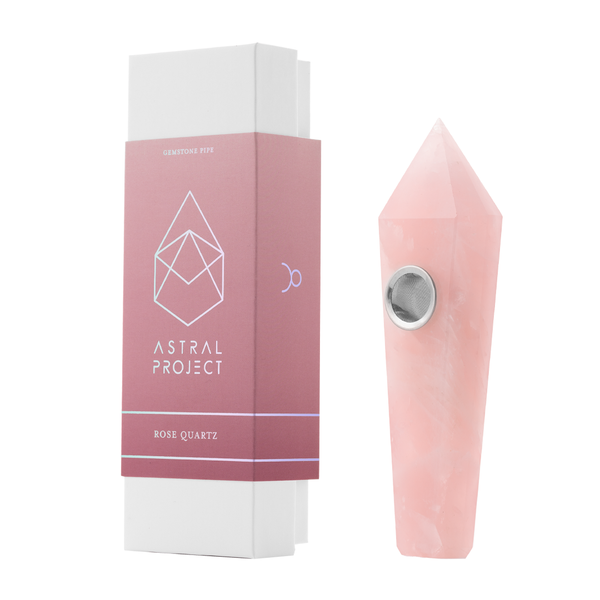 Astral Project gemstone pipe made of rose quartz with a smooth, polished surface, showcasing a natural pink hue and elegant design.