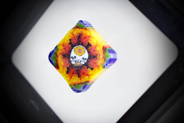 East Atlanta S&V AKM Glass Pipe Maker with Banjo Glass Tie-Dye Skull Millie design, featuring vibrant colors and detailed craftsmanship.