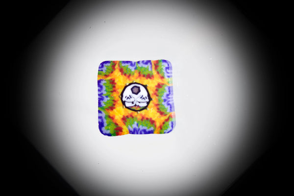 East Atlanta S&V AKM Glass pipe maker tie-dye skull Millie #3, featuring colorful glass with detailed skull design and craftsmanship.