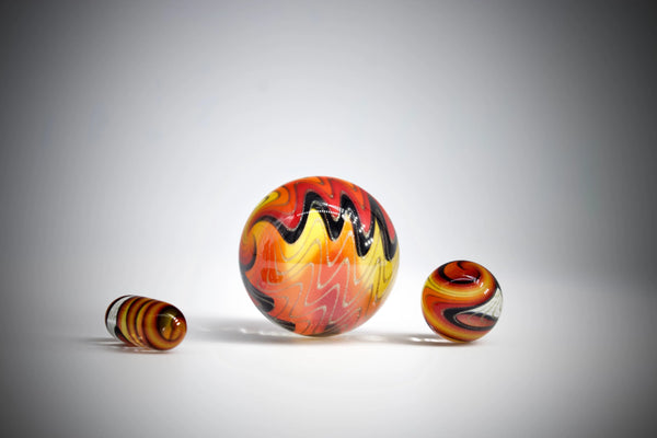 East Atlanta S&V Reverend Morse Fire Tech Slurper Set 2021 with colorful glass pipes and accessories arranged on a wooden surface.