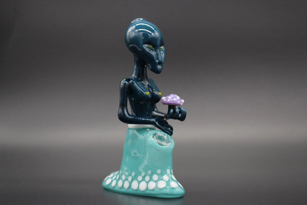 Colorful glass sculpture of the Alien Goddess by Level 42 Gallery, showcasing intricate glasswork and vibrant hues.