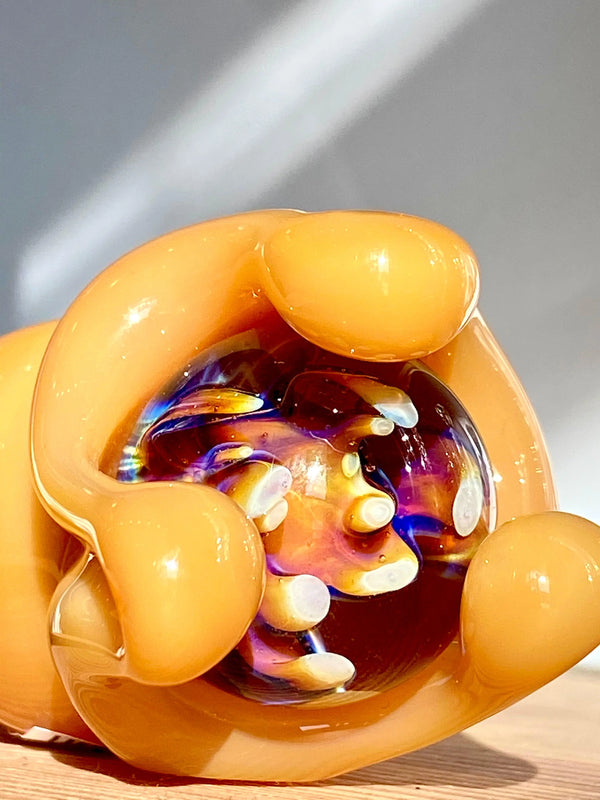 Nicko Glass marble spinner glass pipe with colorful marble design, showcasing smooth glass craftsmanship and intricate detailing.