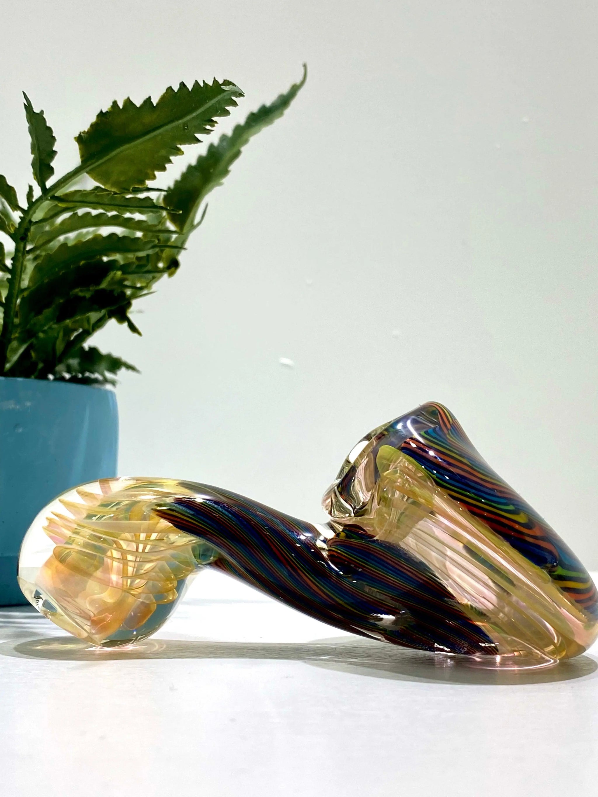 Color coil glass pipe by Talent Glass Works Inc, featuring vibrant, intricate glass art and a classic pipe shape.