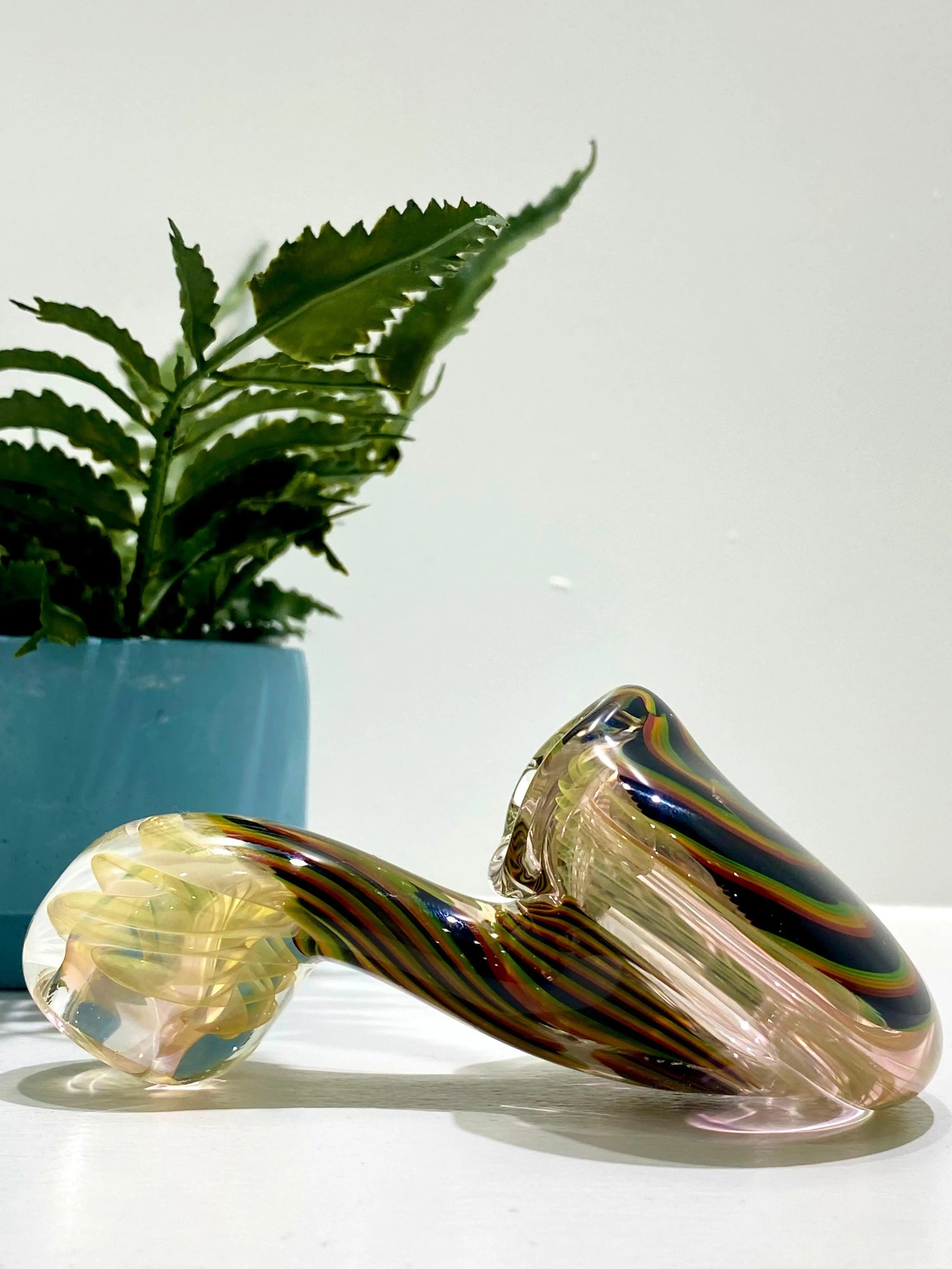 Color Coil Sherlock glass pipe by Talent Glass Works Inc, featuring a vibrant coiled design and clear glass construction.
