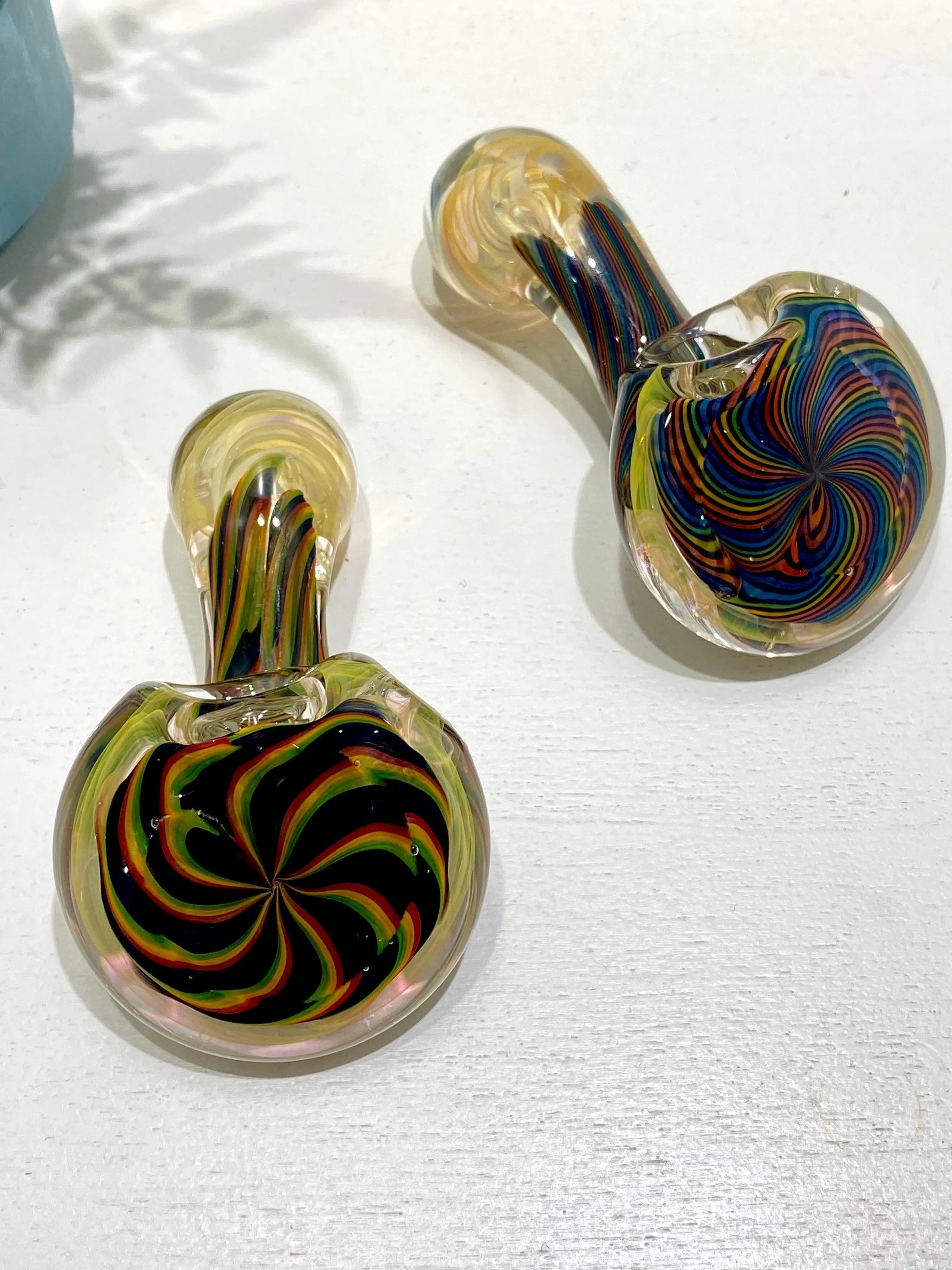 Color coil glass pipe by Talent Glass Works Inc featuring vibrant, swirling glass design with a smooth bowl and elongated shape.
