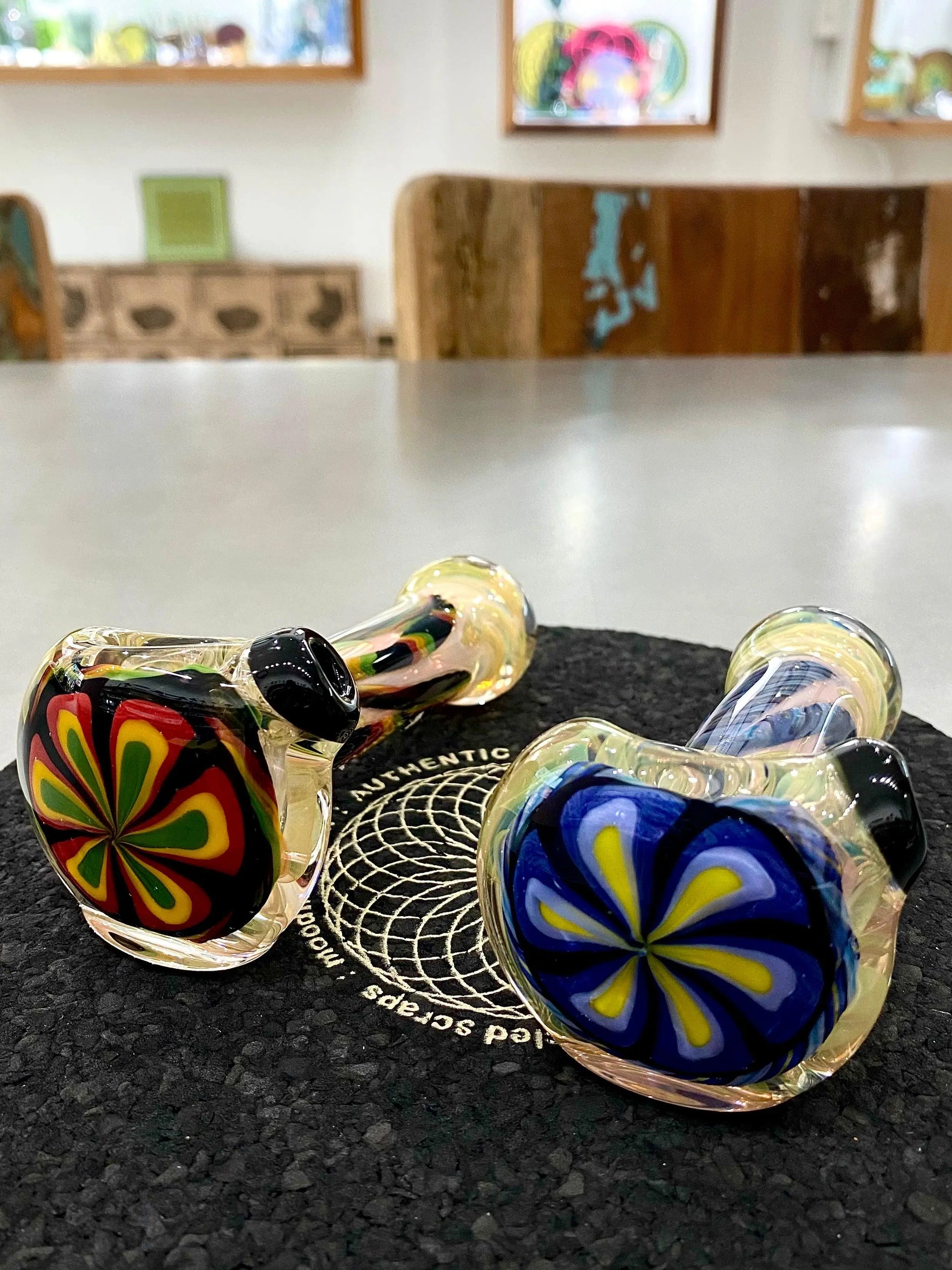 Color flower glass pipe by Talent Glass Works Inc featuring vibrant flower designs and clear glass construction.